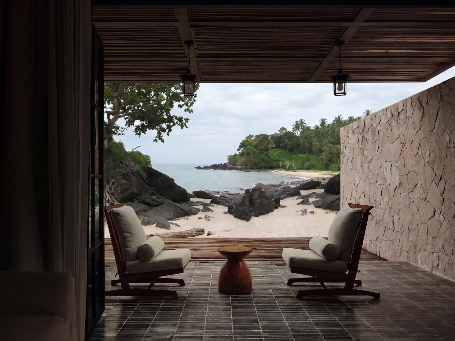 Shaded terrace opening to the rocky cove