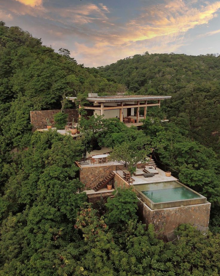 Hillside pavilion with terraced pool above the canopy